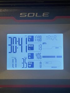 LCD display showing a 30-minute treadmill session burning 400 calories